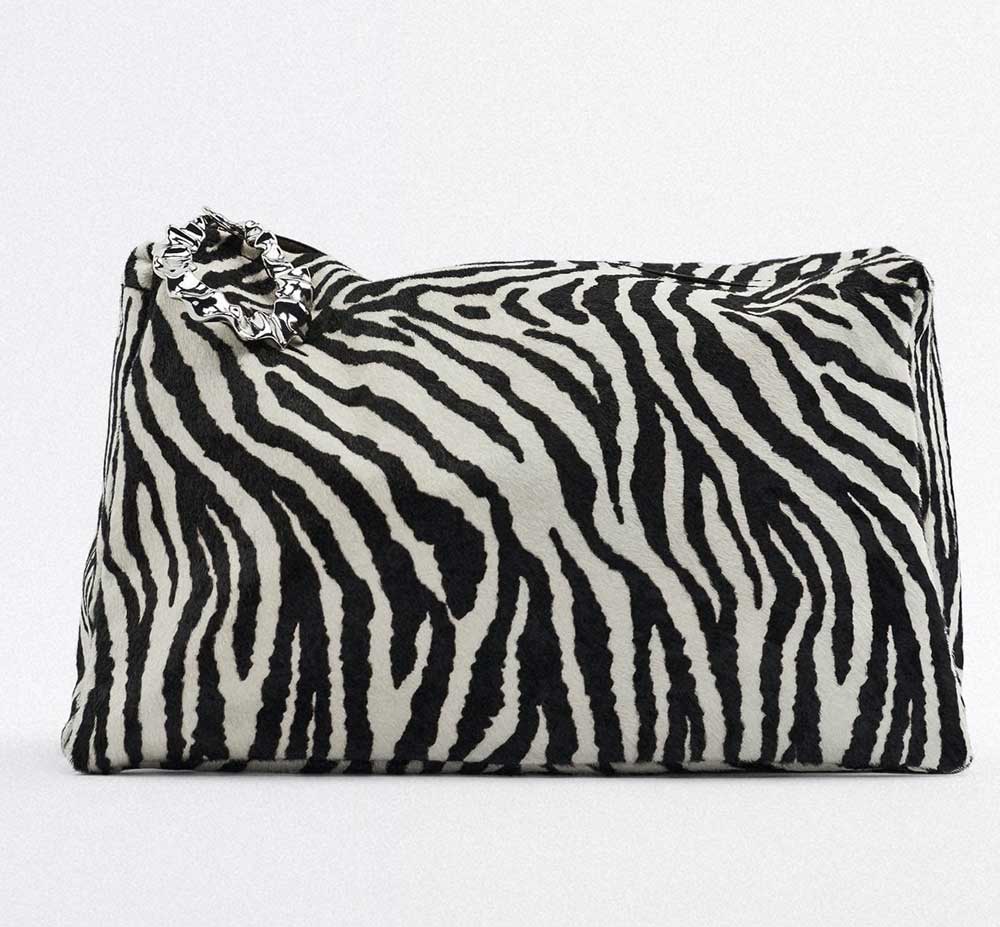 Clutch in pelle con stampa animalier