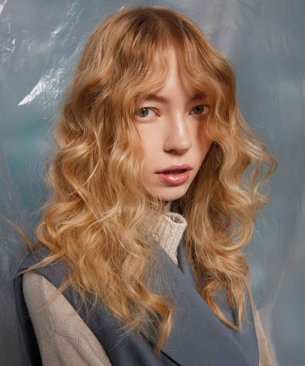 Capelli lunghi mossi scalati Capelli lunghi mossi scalati