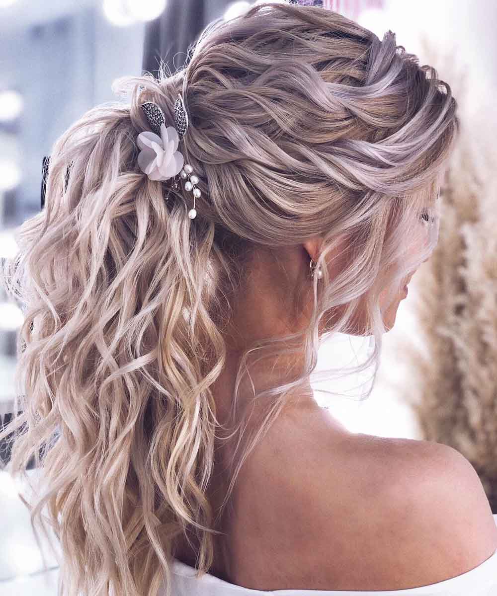 Acconciature coda alta capelli mossi Acconciature coda alta capelli mossi