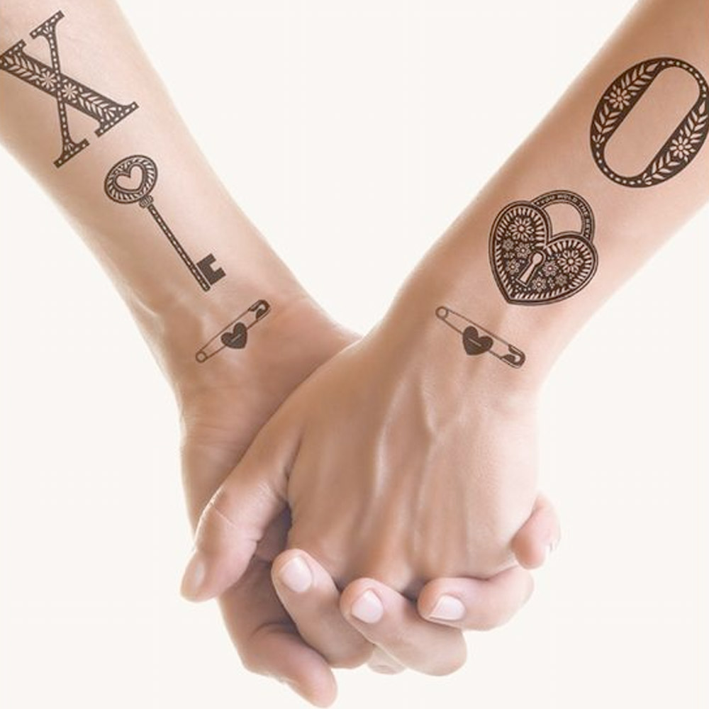 Tattoo di coppia chiave e lucchetto
